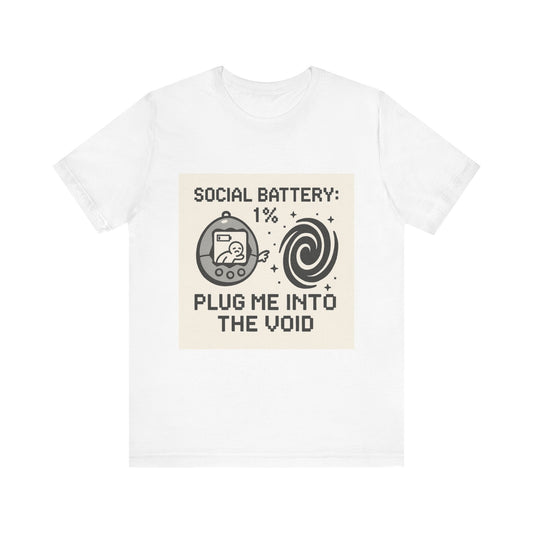 Social Battery 1% t-shirt with Tamagotchi graphic and "Plug Me Into the Void" text on white background